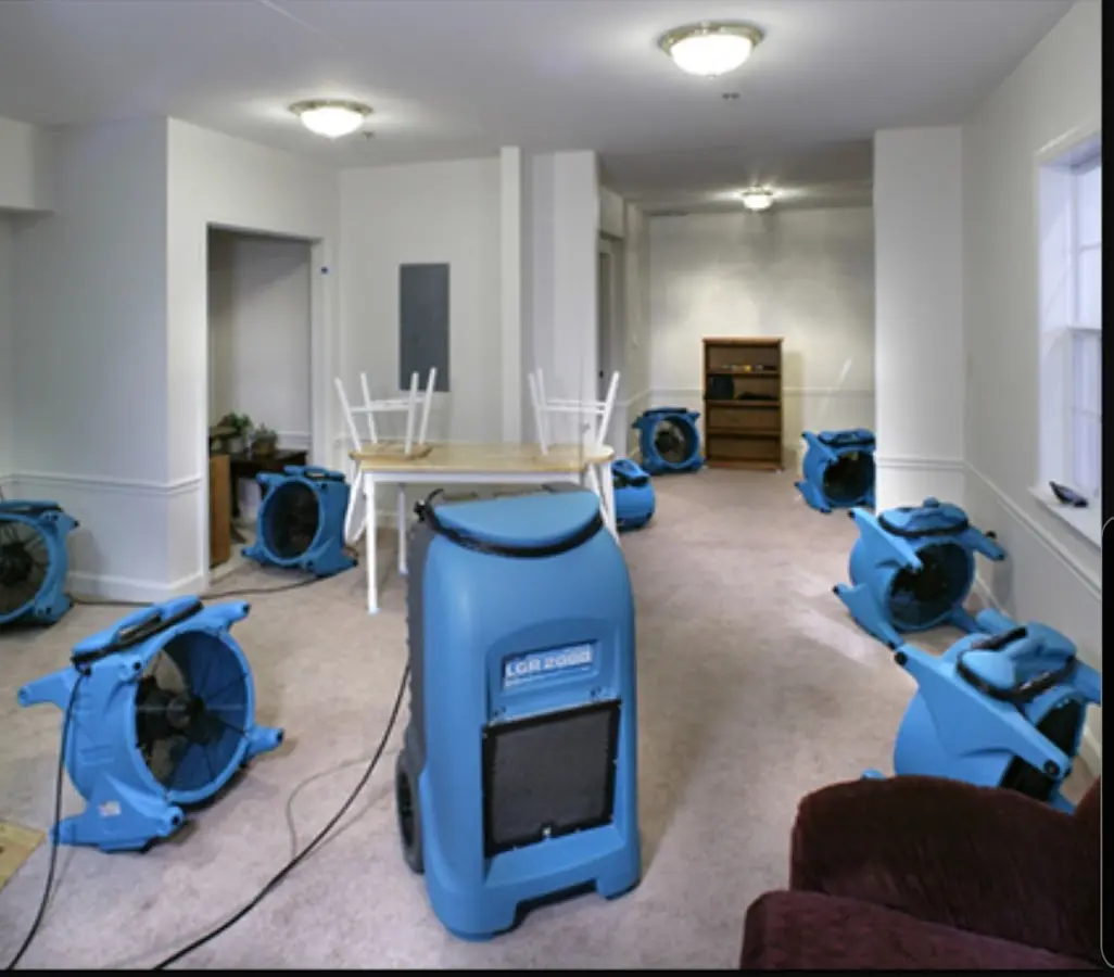 Air movers and dehumidifier setup for Water Damage Restoration in Massena