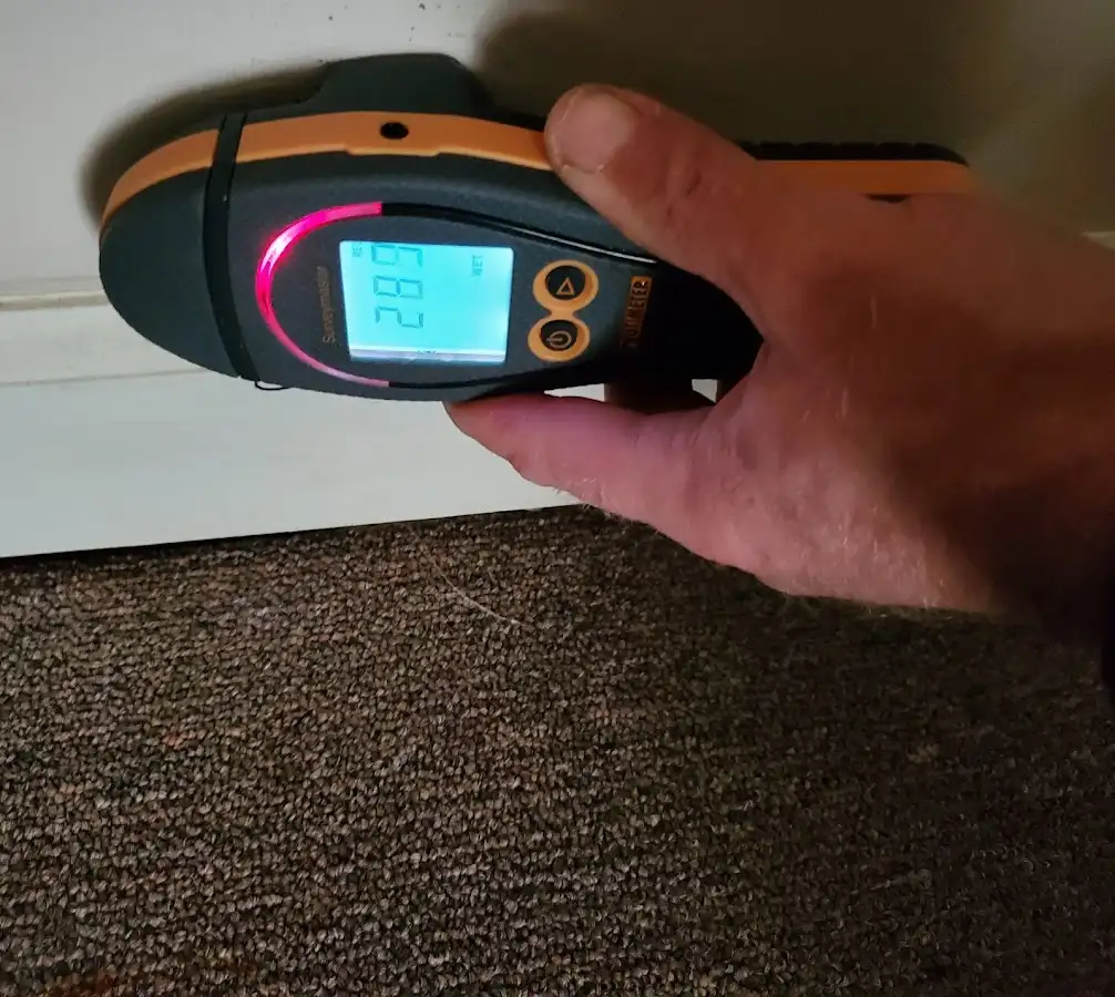 Moisture detection at baseboard during Burst Pipe Cleanup in Massena